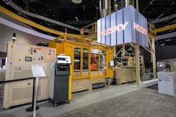 Husky's new HyPET6e injection molding machine worked alongside an integrated drying system to produce preforms comprised entirely of 100 percent recycled PET. Husky's new HyPET6e injection molding machine worked alongside an integrated drying system to produce preforms comprised entirely of 100 percent recycled PET.