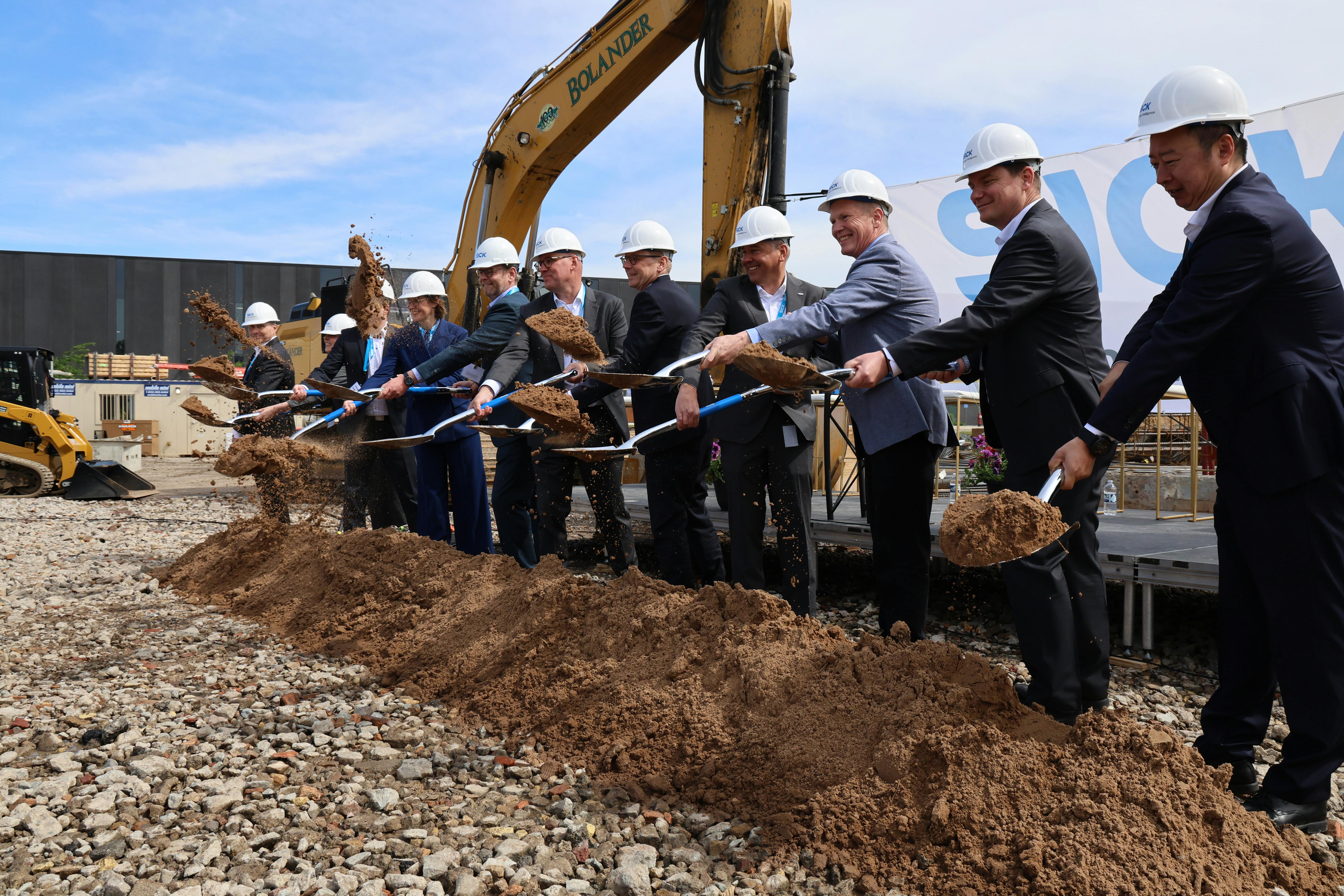 Executives of Sick Inc. take part in the ceremonial groundbreaking of an expansion project that will add 139,000 square feet of space to its Bloomington, Minn., location.