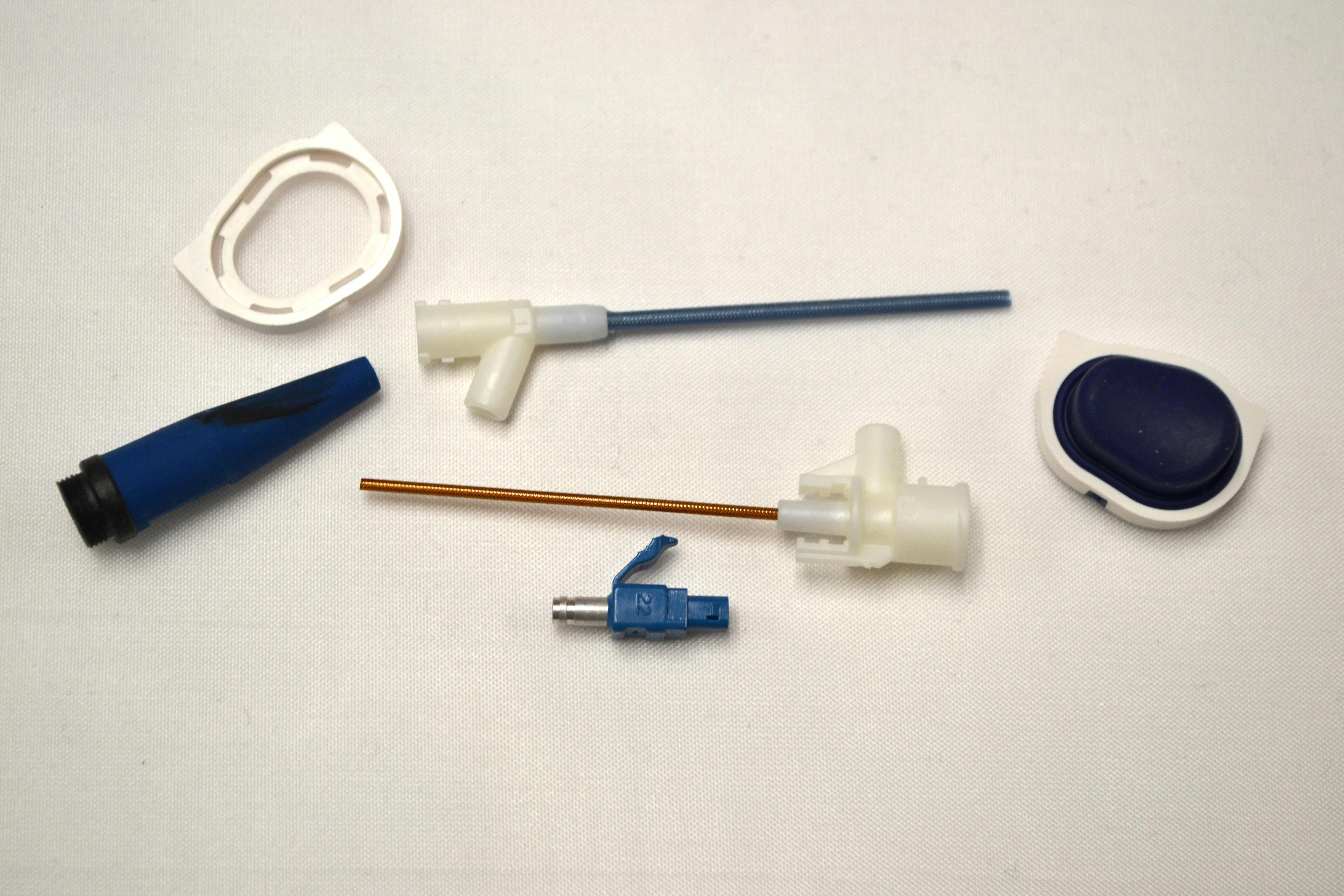 C&J Industries' new Nissei press allows the company to overmold parts like these, for the medical and telecom industries.