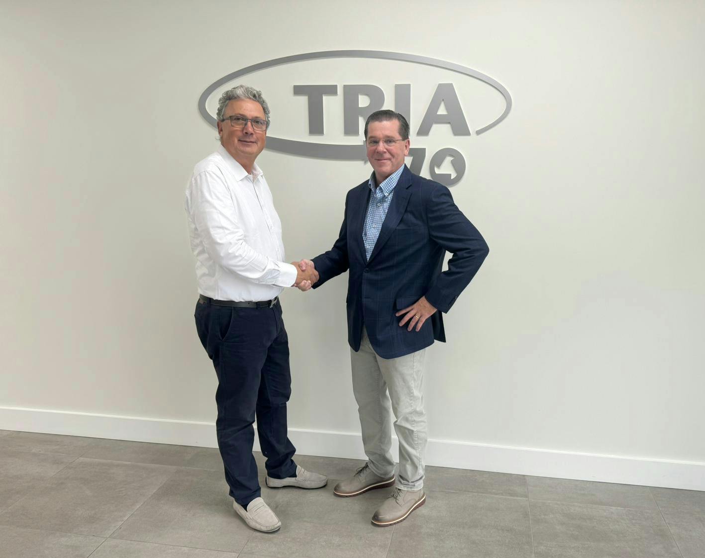 Sales Manager Paolo Tonello, left, welcomes Tria America's new President, Kirk Winstead.