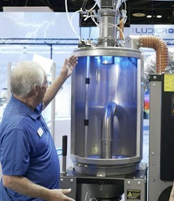 An operator looks over Novatec’s new DryerGenie. An operator looks over Novatec’s new DryerGenie.