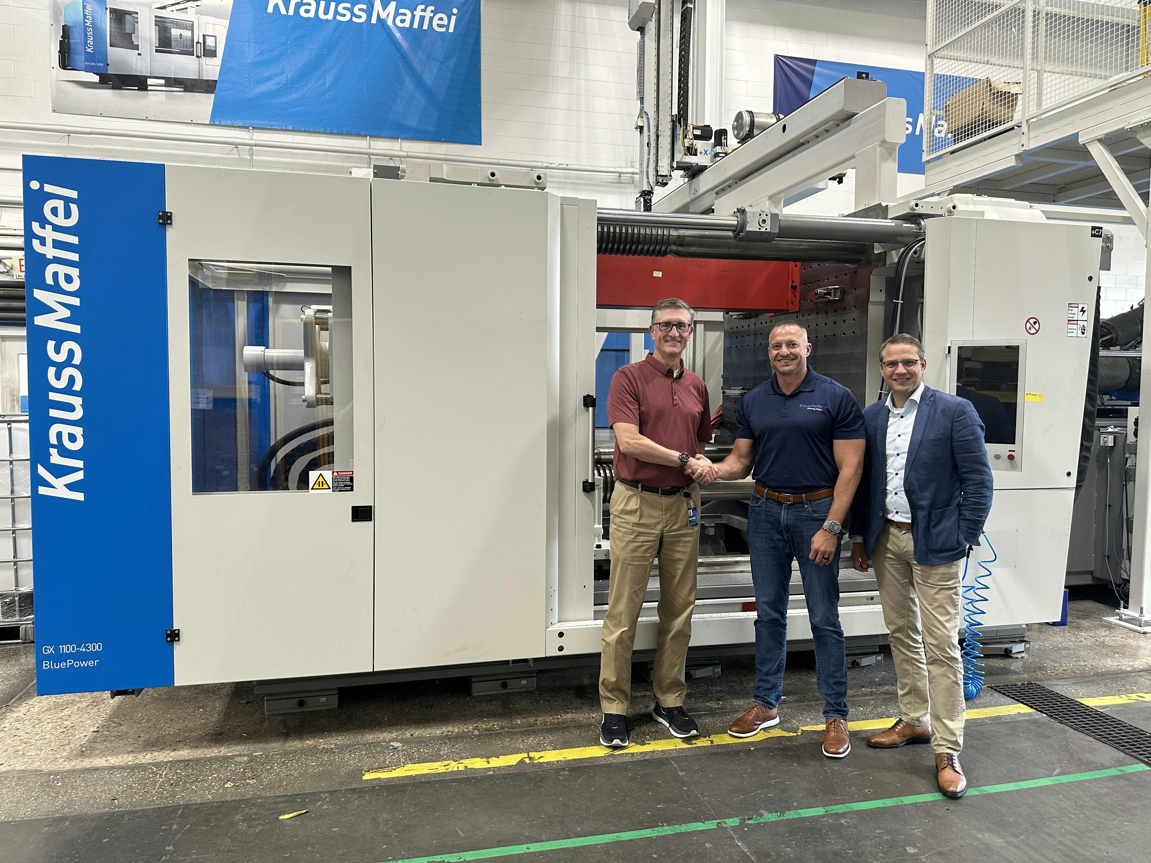 Nolan Strall, center, is handing over leadership of KraussMaffei Corp. to Brett Greenhalgh, left. Managing Director J&ouml;rg Stech is at right.