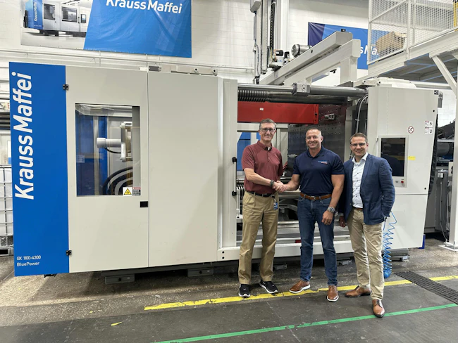 Nolan Strall, center, is handing over leadership of KraussMaffei Corp. to Brett Greenhalgh, left. Managing Director J&ouml;rg Stech is at right.