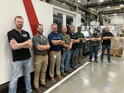 Members of the Milacron and American Plastic Molding (APM) team meet July 30 at Milacron's headquarters ahead of the installation of a new injection molding machine at APM. Members of the Milacron and American Plastic Molding (APM) team meet July 30 at Milacron's headquarters ahead of the installation of a new injection molding machine at APM.