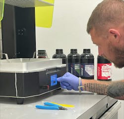 An American Plastic Molding employee works with a Mega 8K S from Phrozen. The molding shop is experimenting with the printer to learn about the capabilities additive manufacturing might offer for customers. An American Plastic Molding employee works with a Mega 8K S from Phrozen. The molding shop is experimenting with the printer to learn about the capabilities additive manufacturing might offer for customers.