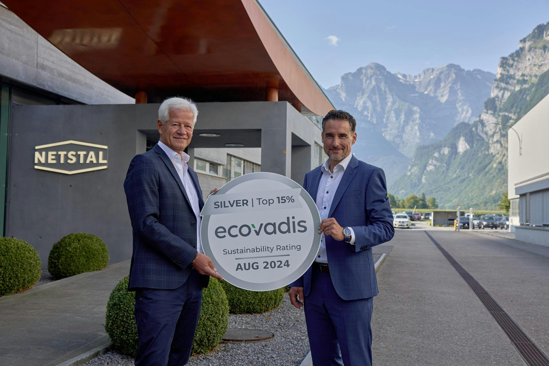 Netstal CEO Renzo Davatz, right, and Michael Rocholl, head of quality and process management, hold the company&rsquo;s Ecovadis silver medal.