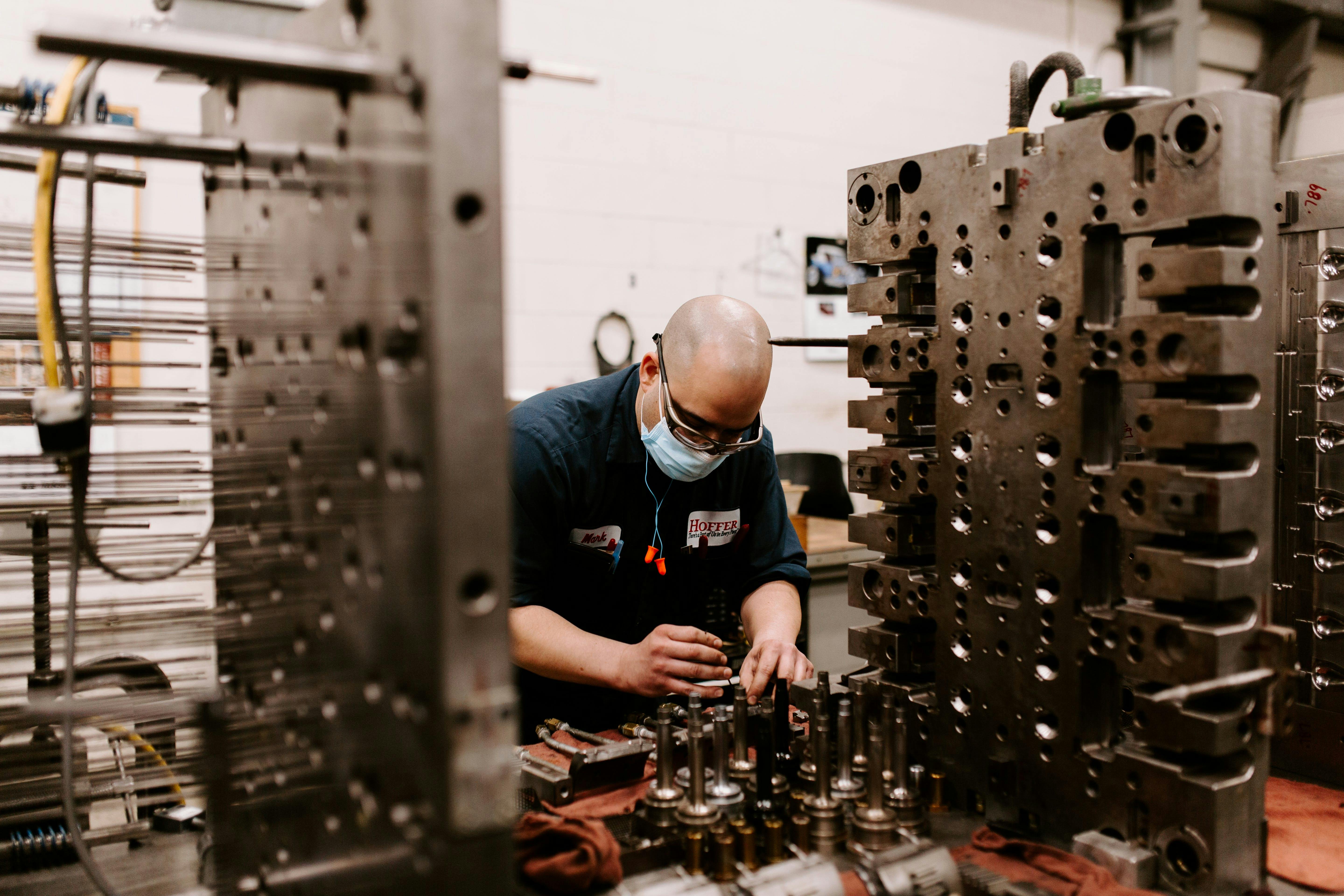 A technician works on a mold at Hoffer Plastics. The injection molder has been named one of IndustryWeek's 'Best Plants.'