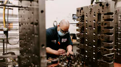A technician works on a mold at Hoffer Plastics. The injection molder has been named one of IndustryWeek's 'Best Plants.'