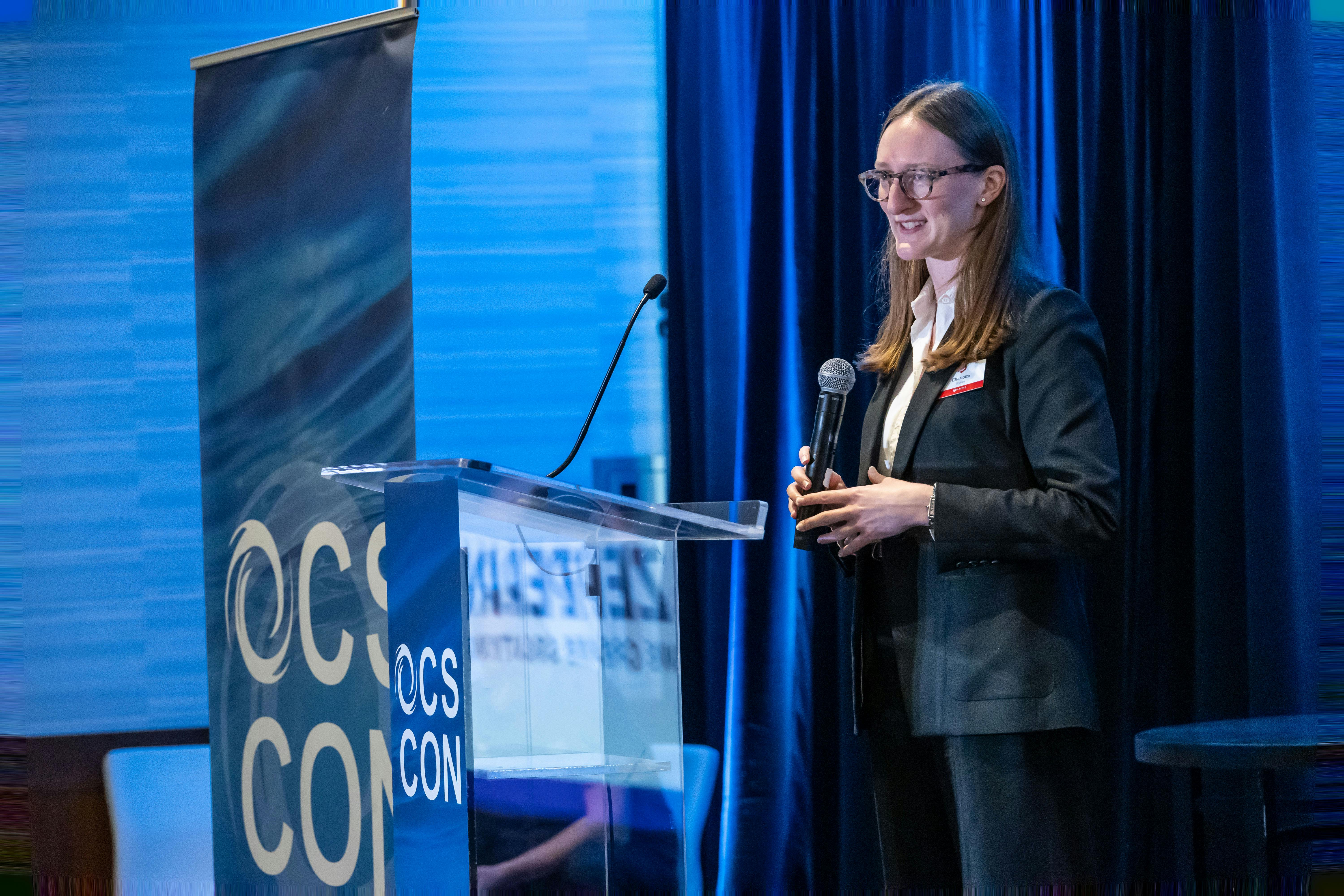 Charlotte Dreizen, PLASTICS' director of sustainability and environment, speaks at the first OCS CON in Houston.