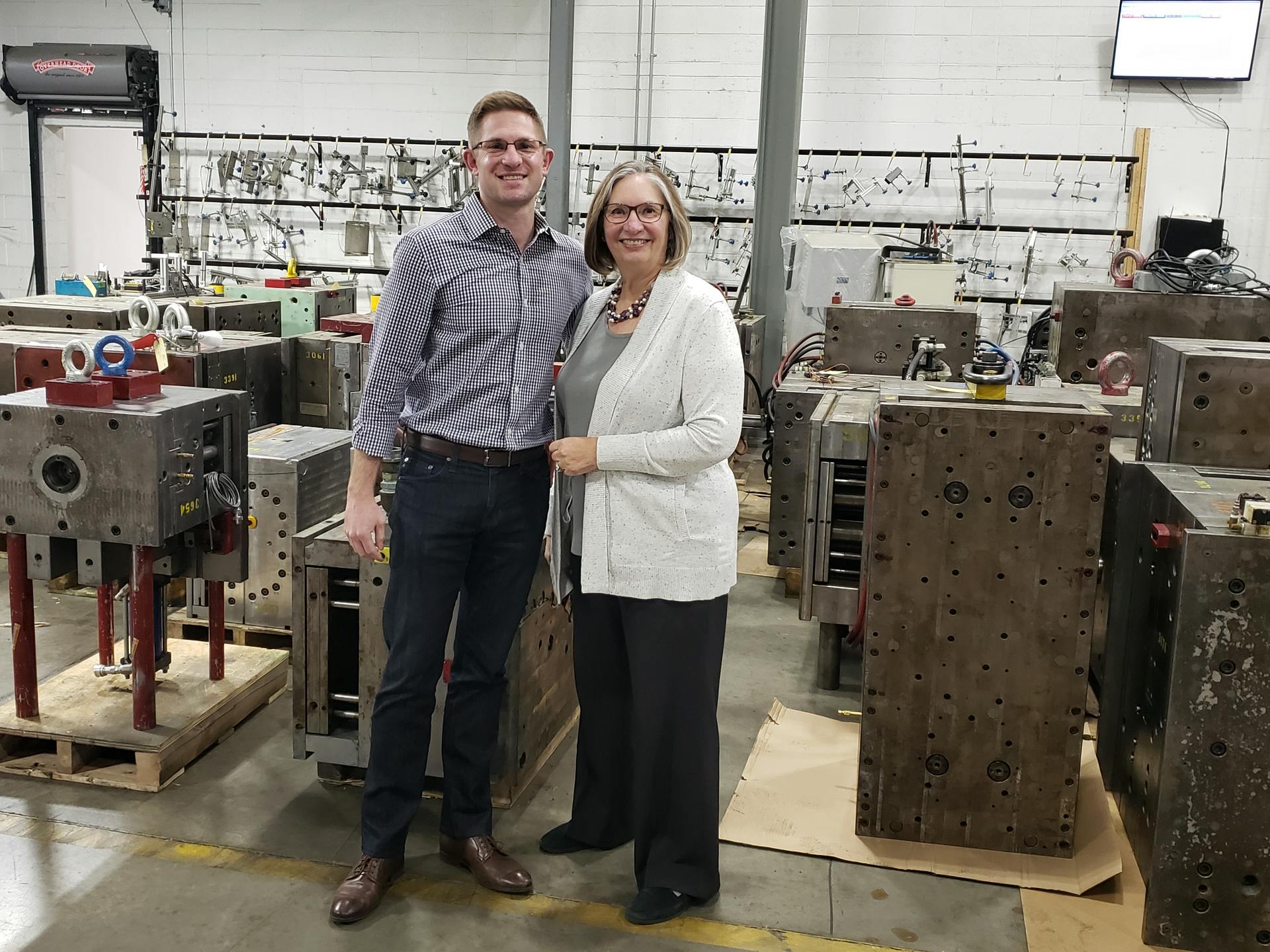 Maureen Steinwall poses with her son, Tom Smolenski, who has taken over day-to-day control of Steinwall Inc., an injection molding shop her father started.