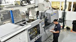 Amid hiring challenges, molders have invested in automation. Among them is Rockford, Ill., Pyramid Plastics, where a Yushin robot is shown stationed above a press. Amid hiring challenges, molders have invested in automation. Among them is Rockford, Ill., Pyramid Plastics, where a Yushin robot is shown stationed above a press.