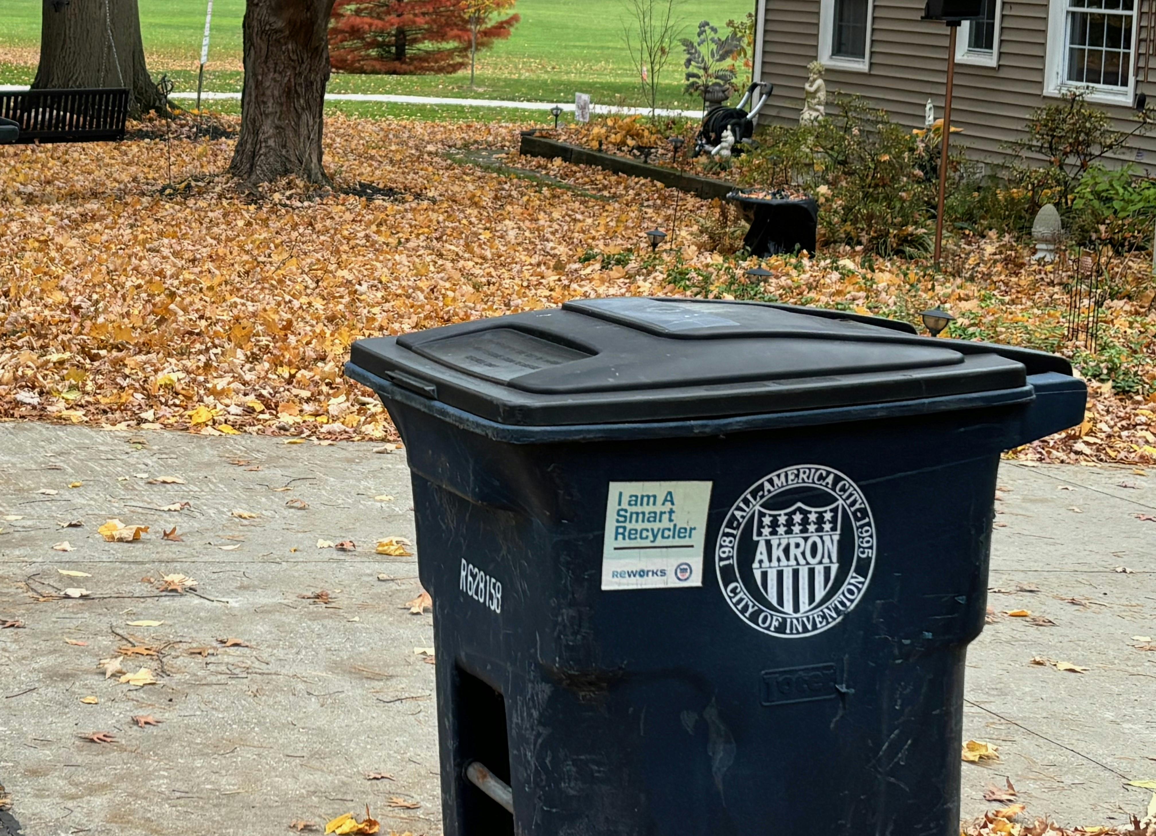 A recycling bin awaits collection on a curb in Akron, Ohio.