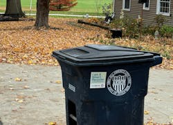 A recycling bin awaits collection on a curb in Akron, Ohio. A recycling bin awaits collection on a curb in Akron, Ohio.