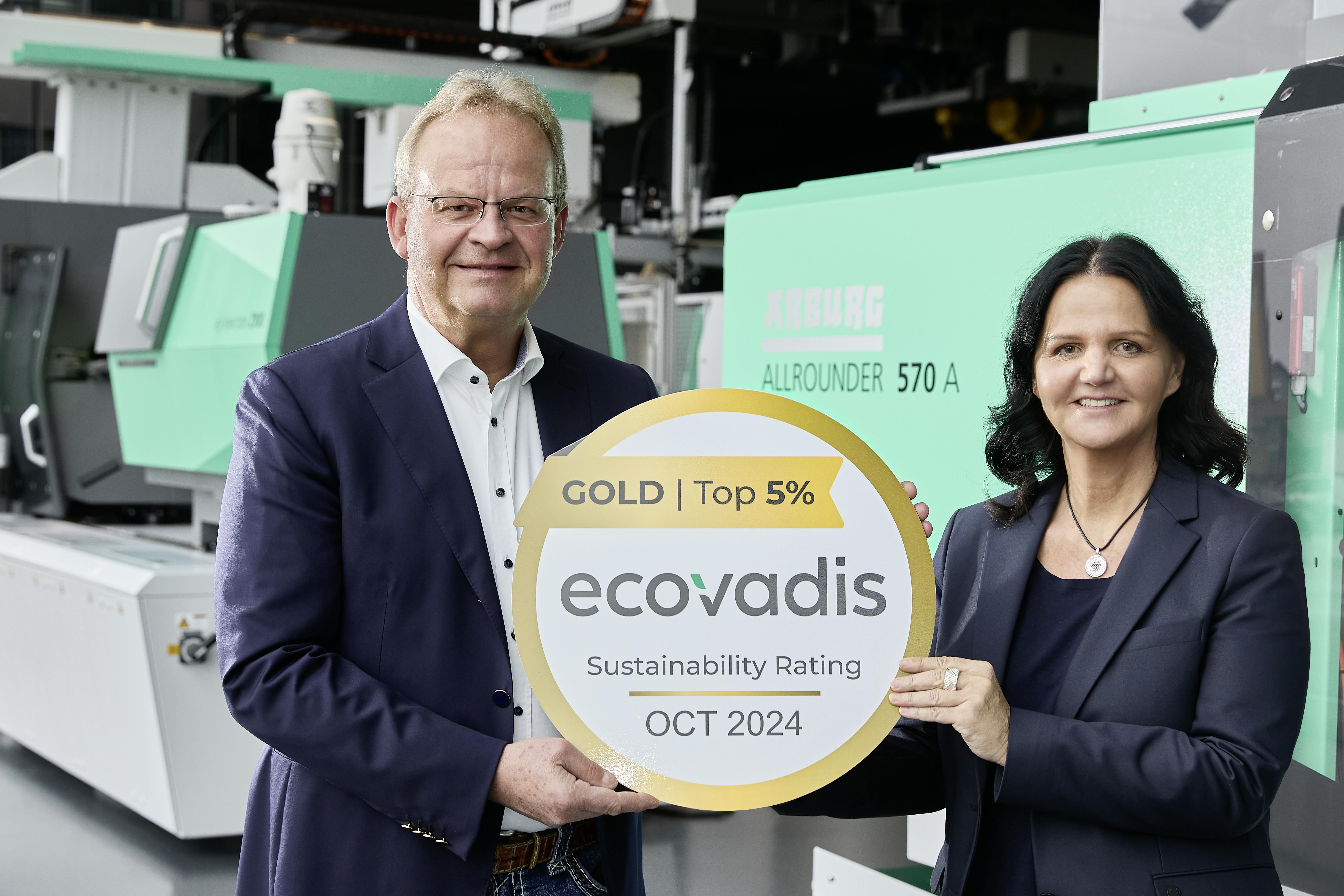 Managing Partners Michael and Juliane Hehl display Arburg's EcoVadis Gold Medal.
