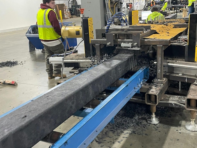 An Evertrak 7000 composite railroad tie passes through the texturing station, which creates additional grip on the tie's surface.