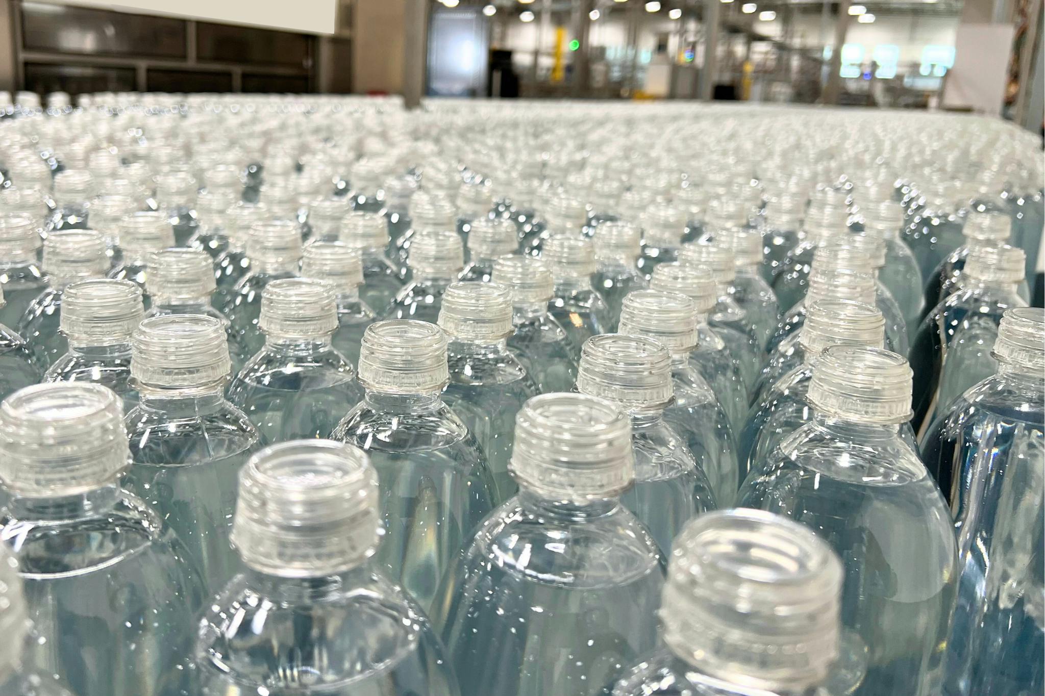 Bottles with PET caps produced using the CapFormer thermoforming process,