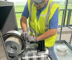 As part of a SureLaunch visit, a Conair technician inspects and validates the installation of a large central vacuum pump prior to successful commissioning and startup of a conveying system. As part of a SureLaunch visit, a Conair technician inspects and validates the installation of a large central vacuum pump prior to successful commissioning and startup of a conveying system.