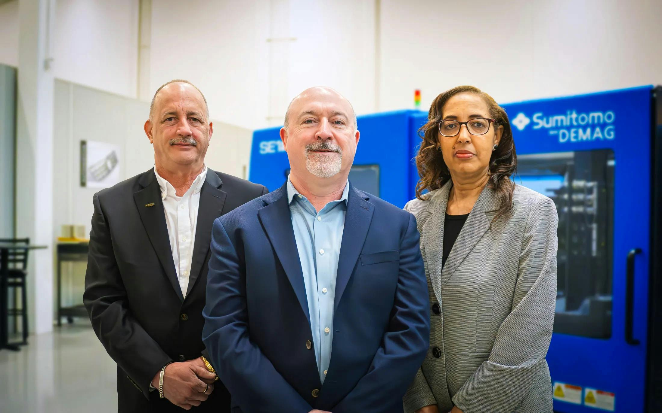 From left, Executive VP and COO John F. Martich III, President Liam Burns and Corporate Controller and Compliance Officer Beth Belay of Sumitomo (SHI) Demag.