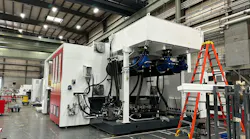 A 1,500-ton injection molding machine is shown under construction at Milacron's Batavia, Ohio, facility in 2023.