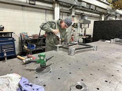 A Bekum America fabrication team member works on a blow molding machine platen. A Bekum America fabrication team member works on a blow molding machine platen.