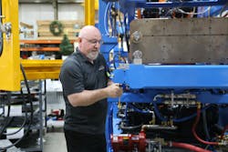 Jim Vezina, a lead assembly technician at Rocheleau Tool & Die, works on equipment at the family-owned shop. Established in 1938, the company has dealt with customers and suppliers that have merged, consolidated and broken apart as it's built its niche as a manufacturer of blow molding machines. Jim Vezina, a lead assembly technician at Rocheleau Tool & Die, works on equipment at the family-owned shop. Established in 1938, the company has dealt with customers and suppliers that have merged, consolidated and broken apart as it's built its niche as a manufacturer of blow molding machines.