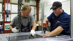 Mold repair and service make up a big part of Decatur Mold's business. Rhonda Lustenberger, majority owner and president of the North Vernon, Ind., mold making plant, says, 'repair work takes a different skill set that I think a lot of people don't have,' compared with building new molds, which 'can be more scientific.' Mold repair and service make up a big part of Decatur Mold's business. Rhonda Lustenberger, majority owner and president of the North Vernon, Ind., mold making plant, says, 'repair work takes a different skill set that I think a lot of people don't have,' compared with building new molds, which 'can be more scientific.'