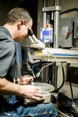 A Velocity Group technician performs laser welding on a mold insert for use in a multiple-cavity mold. A Velocity Group technician performs laser welding on a mold insert for use in a multiple-cavity mold.
