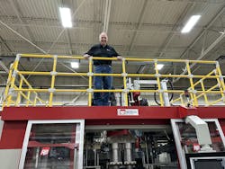 R&B Plastics Machinery President and GM Fred Piercy atop a blow molding machine at the company's Saline. Mich., plant. R&B Plastics Machinery President and GM Fred Piercy atop a blow molding machine at the company's Saline. Mich., plant.