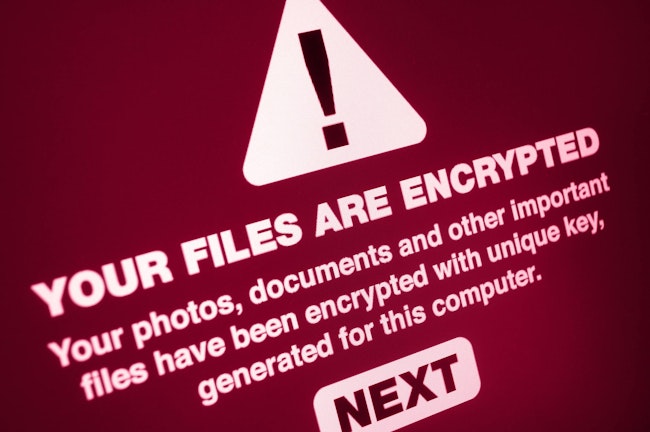 Computer screen displays notification of a cyberattack.