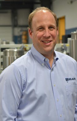 Jason Sears, president and owner of Dri-Air Industries, in a blue shirt on the shop floor. Jason Sears, president and owner of Dri-Air Industries, in a blue shirt on the shop floor.
