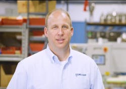 Jason Sears on shop floor in blue shirt Jason Sears on shop floor in blue shirt