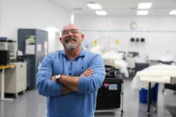 Greg Graham on the floor of Kent Elastomer Products Inc. in a blue shirt Greg Graham on the floor of Kent Elastomer Products Inc. in a blue shirt