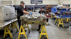 Mold builders assembling a mold. Mold builders assembling a mold.