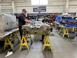 Mold builders assembling a mold. Mold builders assembling a mold.