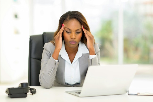 A worried executive at her desk.