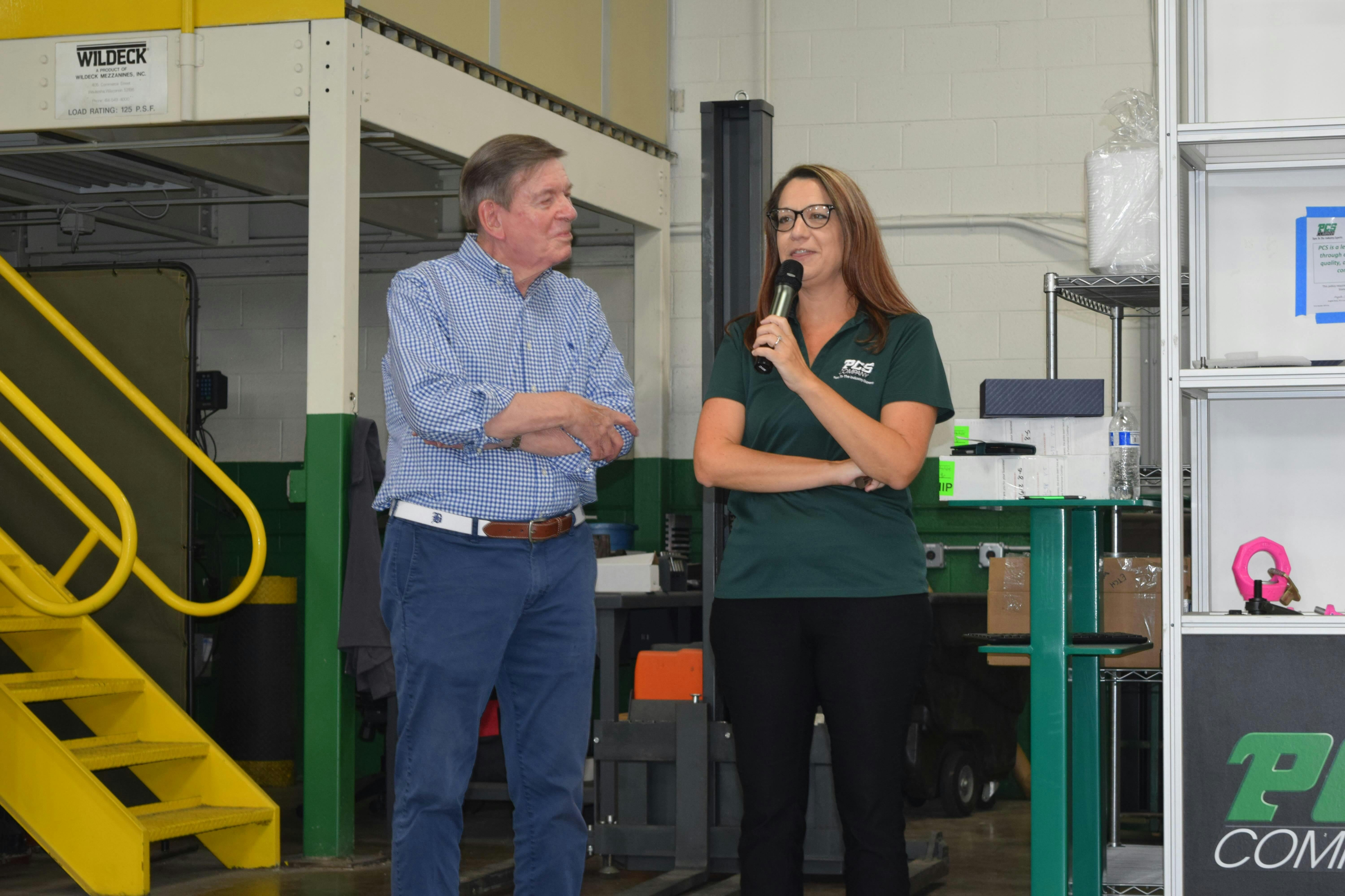 PCS Co. President Angela Elsey honors former company co-owner Jim Stuart earlier this summer during a party marking the company's 75th anniversary. &ldquo;Seventy-five years is unbelievable,&rdquo; Elsey told PCS staff during a short presentation at the luncheon. &ldquo;I can&rsquo;t be more proud to be just a small part of the 75-year history and so grateful to all of you.' Stuart, the son of the founder of PCS, attended the event along with several retired PCS employees. He received a machined ejector pin to commemorate his legacy &ldquo;My father and his partner would not believe&rdquo; how far PCS has progressed since they started, Stuart said.