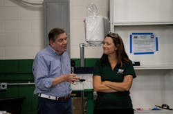 Former PCS Co. co-owner Jim Stuart and company President Angela Elsey celebrate the company's 75th anniversary. Former PCS Co. co-owner Jim Stuart and company President Angela Elsey celebrate the company's 75th anniversary.