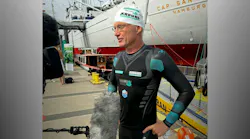 Arburg brand ambassador Andreas Fath, a German chemistry professor, navigates interviews after arriving in Hamburg, Germany, while swimming the Elbe River during one of several events he's organized to highlight the need to protect water resources.