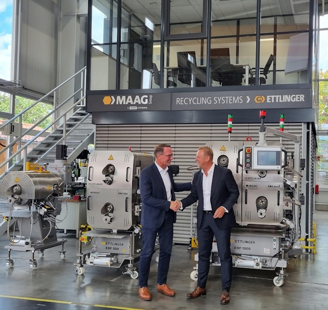 Uwe Kellner, left, VP of sales for the Maag Group in Europe, the Middle East and Africa, welcomes Michael Heitzinger, right, the company’s new manager of business development for recycling systems.