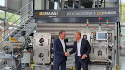 Uwe Kellner, left, VP of sales for the Maag Group in Europe, the Middle East and Africa, welcomes Michael Heitzinger, right, the company’s new manager of business development for recycling systems.