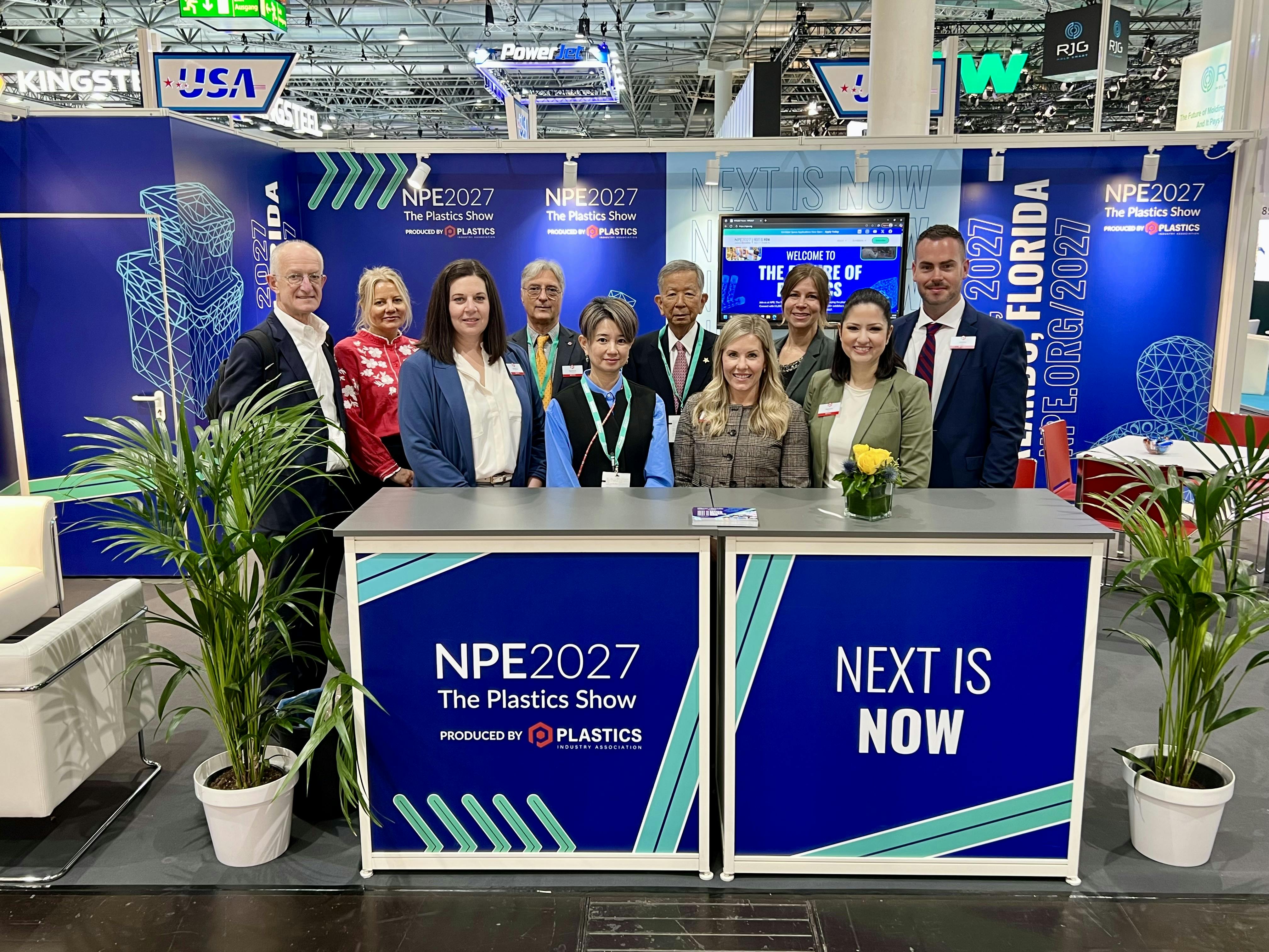 The PLASTICS team at K 2025, where the NPE2027 theme 'Next is Now' was unveiled.