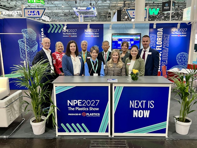 The PLASTICS team at K 2025, where the NPE2027 theme 'Next is Now' was unveiled.