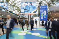 Attendees walk the floor in one of the halls at K 2025. Attendees walk the floor in one of the halls at K 2025.