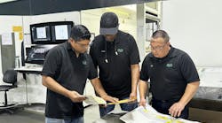 Employees look over materials regarding color matching at Union City, Calif., converter Emerald Packaging. Employees look over materials regarding color matching at Union City, Calif., converter Emerald Packaging.