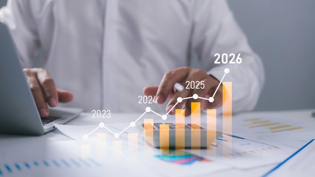 Businessman with computer and 2026 outlook graphic