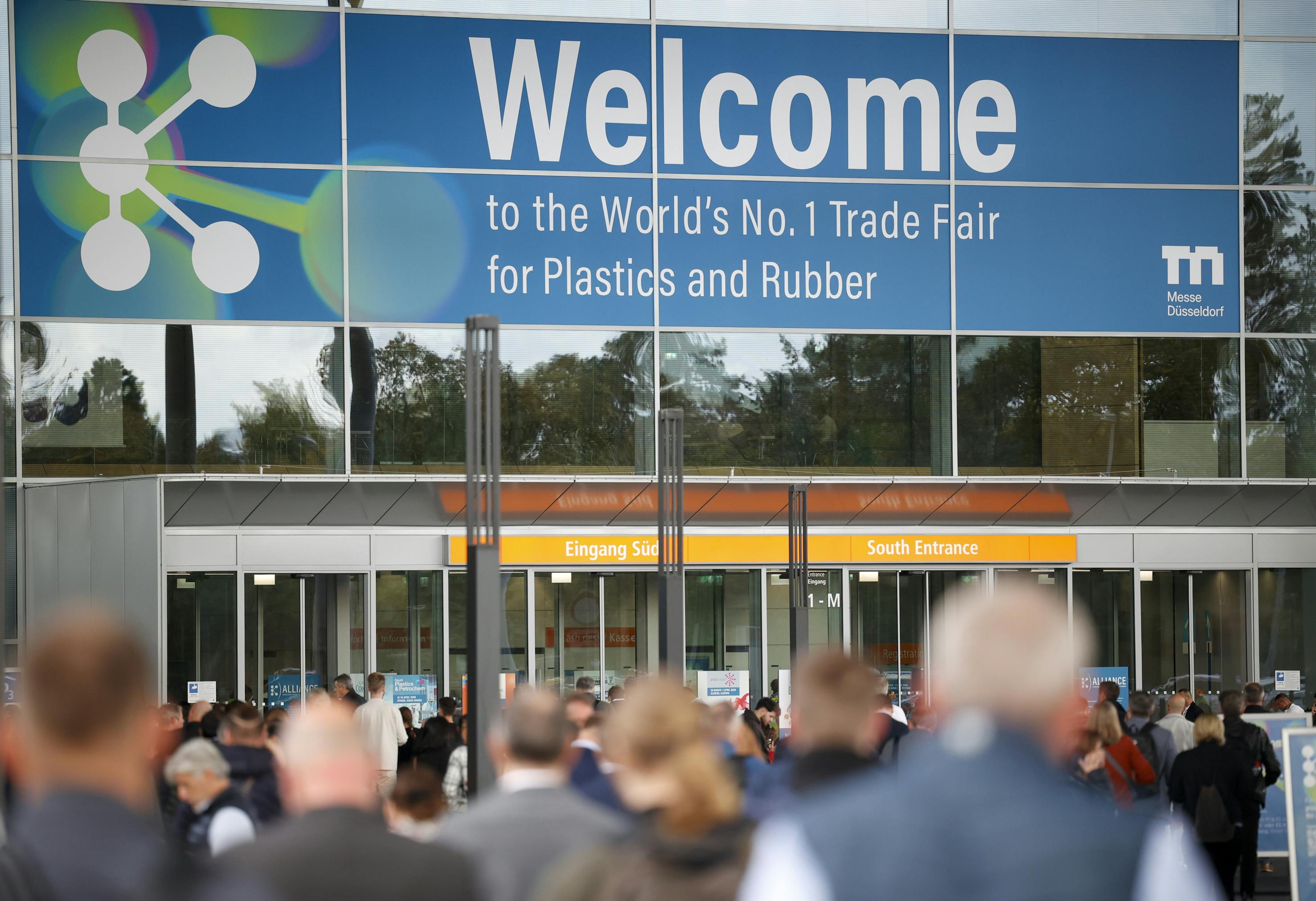 Visitors enter the doorway of an exhibition hall at K 2025.