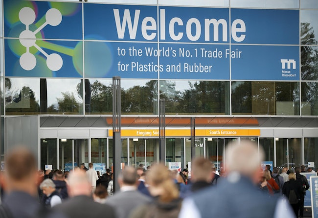 Visitors enter the doorway of an exhibition hall at K 2025.