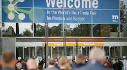 Visitors enter the doorway of an exhibition hall at K 2025.