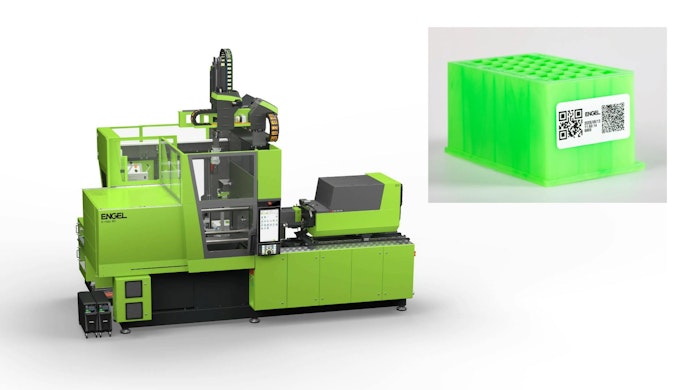 An Engel e-mac 800 injection molding machine and a green QR-coded part it produced at K 2025.