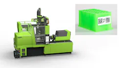 An Engel e-mac 800 injection molding machine and a green QR-coded part it produced at K 2025.